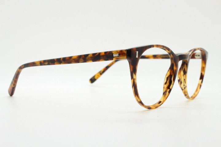 Cubitts vintage round 40s design hand made eye glasses. Honey tortoise acetate optical frame with keyhole bridge. Prescription RX