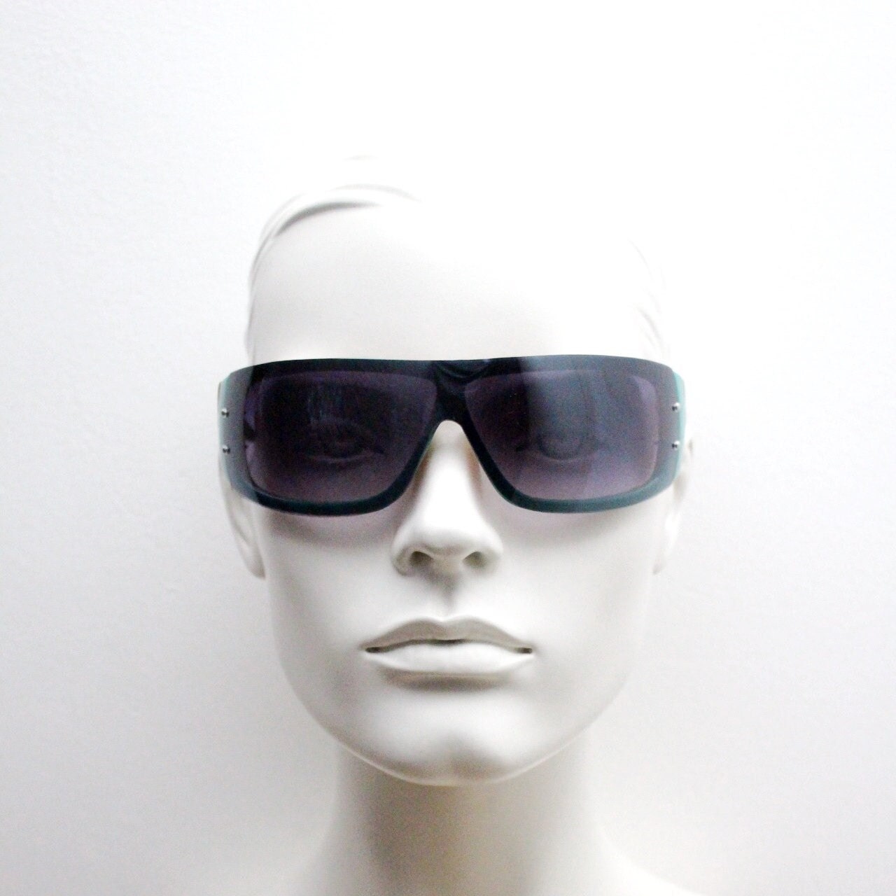 Y2K vintage visor sunglasses. Black massive mask mono lens wrap around shield with turquoise arms. Sick fashion grail. 2000s unused NOS