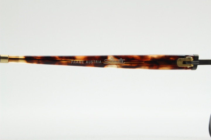 Silhouette vintage 90s flat top oval eye glasses made in Austria. Satin bronze optical frame with honey tortoise trim. Prescription RX