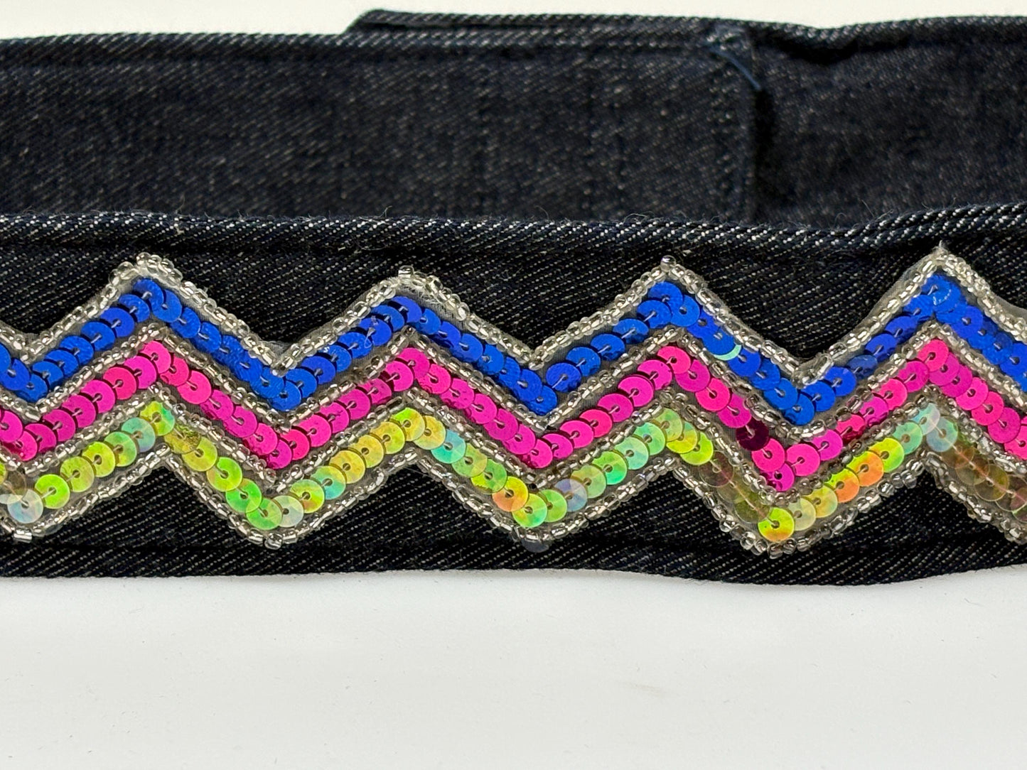 Y2K vintage womens dress belt in dark blue denim with rainbow sequins zig zag applique in neat proportions. Vegan. 2000s Unused NOS