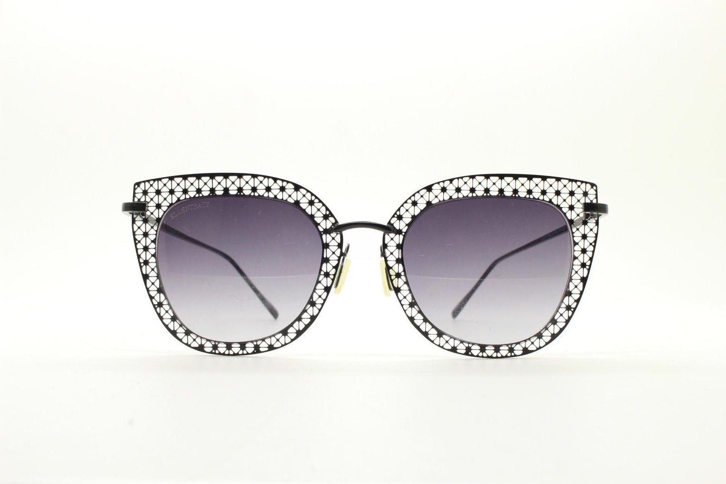 Metal cut out vintage cat eye sunglasses.  Women's imaginative black lacey pattern flat cateye frame with smoky graduating lenses