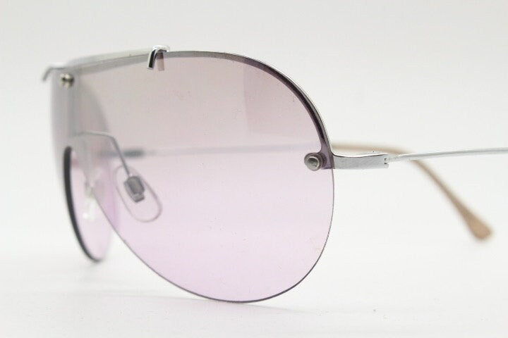 Y2K vintage visor shield sunglasses. Silver chrome half frame with pink wraparound mono lens and mirror glaze. Mini mask. 00's. 2000's NOS