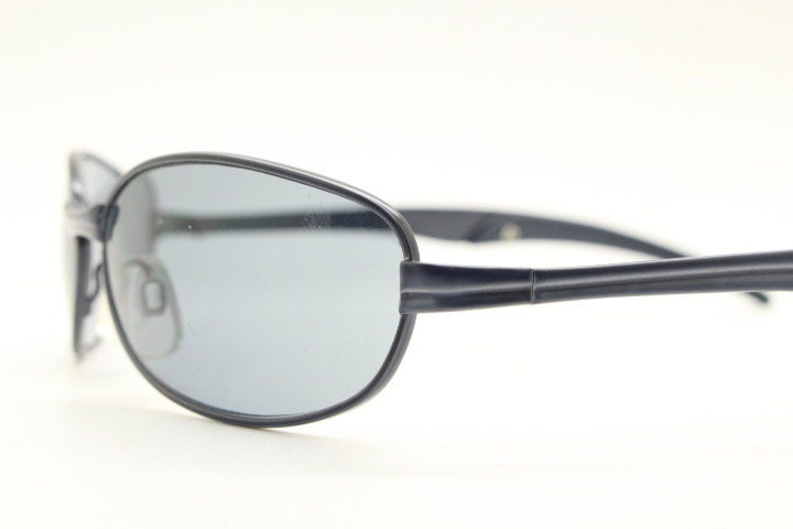 90s vintage oval small bug eye sunglasses. Curved grey satin finish solid metal frame. Rave. Steampunk. Unused NOS