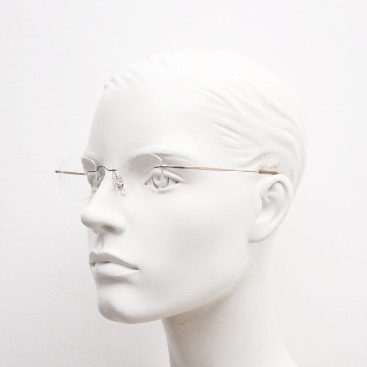 90s vintage angular oval frameless eye glasses. Minimal lightweight titanium optical frame. Flexible prescription RX spectacles