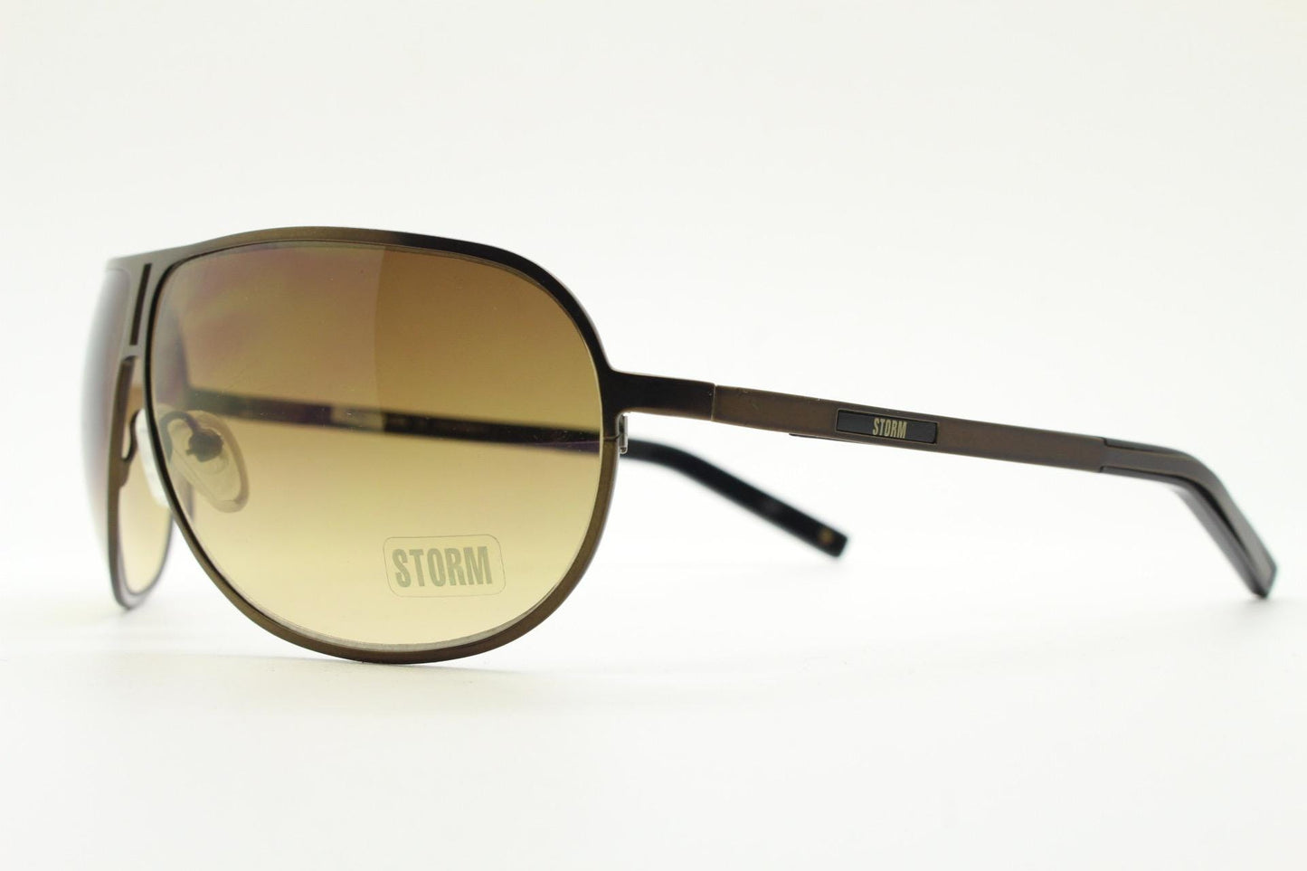 Storm Y2K bug eye aviator sunglasses model Photon. Bronze satin finish shield style aviators with graduating brown lenses.  Unused NOS.