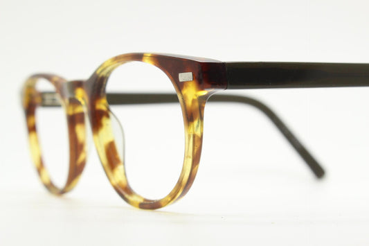 90s Vintage oval eye glasses. Tortoise gloss solid acetate 40s design optical frames with plain black arms. Prescription RX spectacles