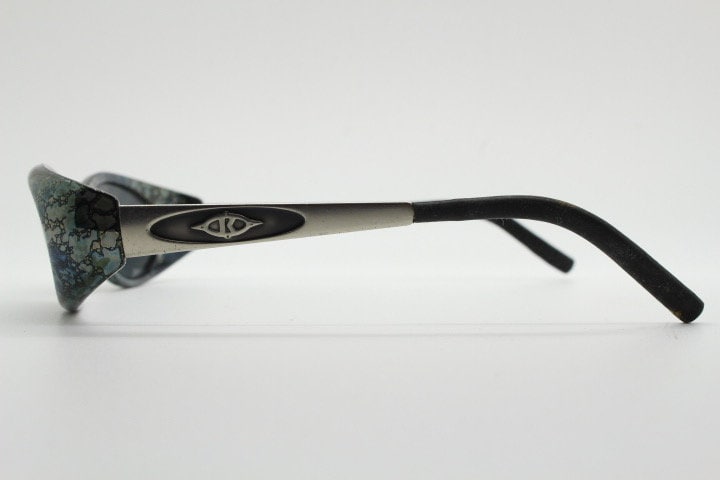 Killer Loop Shedevil 90s vintage shield sunglasses made in Italy. Low profile wrap around design with unique metallic print. One off sample