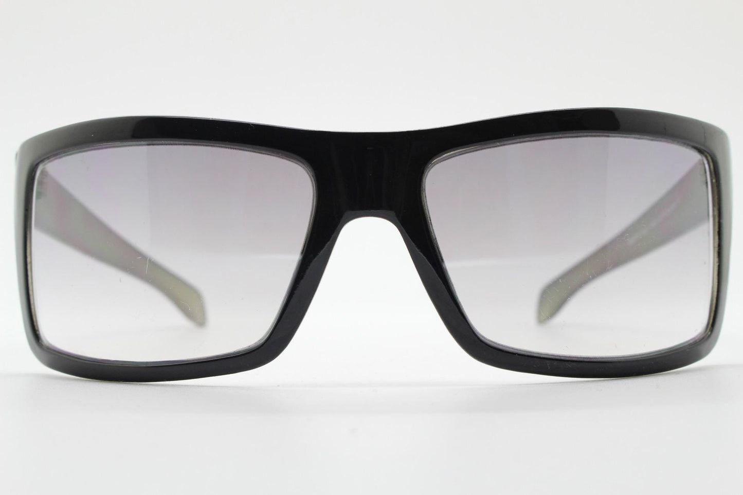 Y2k vintage wrap around large rectangular sunglasses. Curved black gloss frame with tasteful graduating lenses. 2000's NOS
