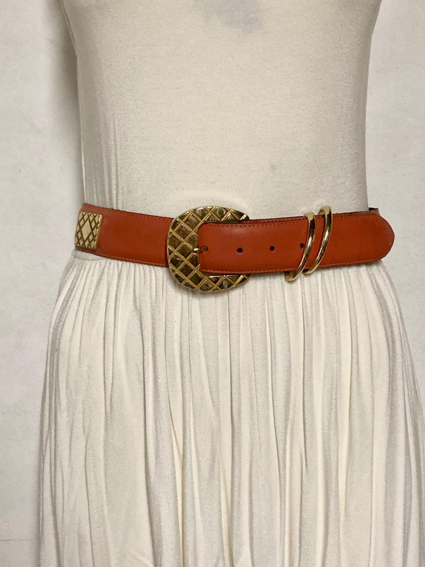 80s vintage womens dress / jeans belt in bright orange leather with golden metal squares. Made in France. Used in good condition
