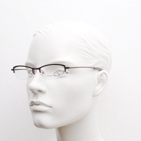 Osiris 90s vintage rectangular half rim eye glasses. Low profile optical frame in handsome brown chrome. Prescription RX Spectacles
