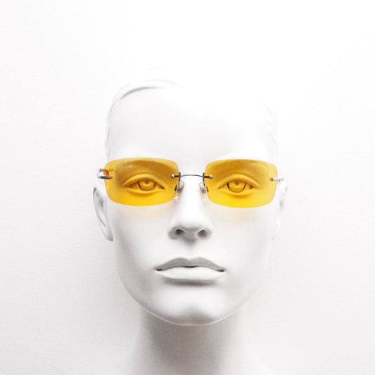 Y2K vintage frameless orange sunglasses. Rectangular wrap around lenses with satin silver bridge and arms. 2000s club kids. 00's. 90s. NOS