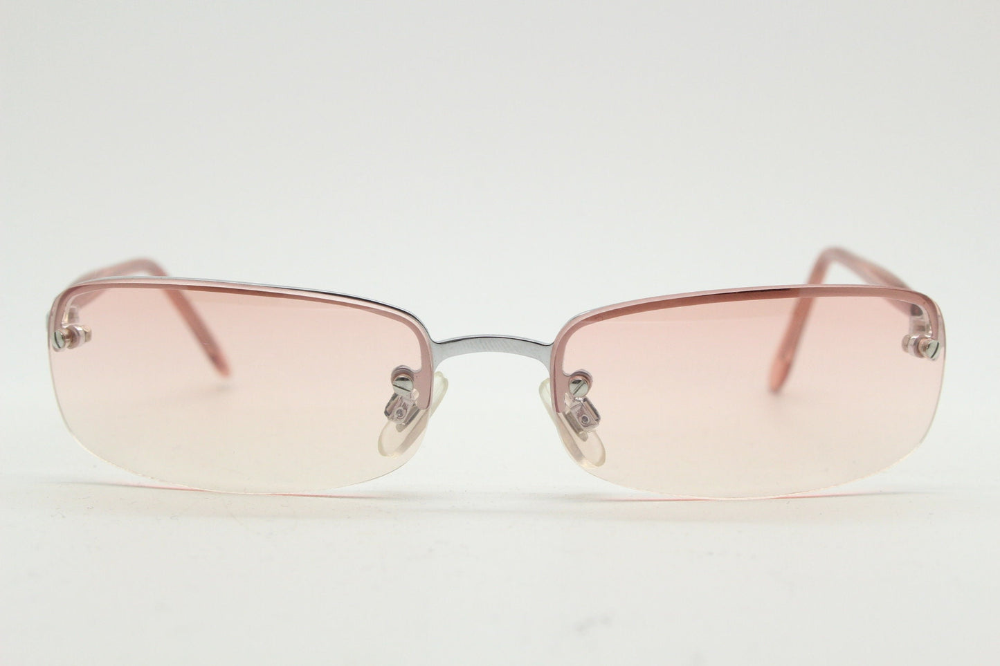 Y2K vintage wrap around rectangular sunglasses. Half frame in sharp chrome with extra light tone pink lenses. Rave 2000's. 00's NOS