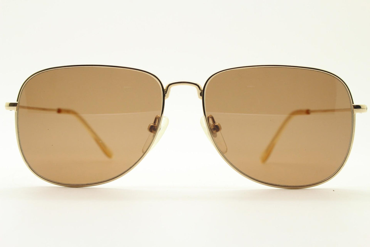 Helmut Lang rectangular 90s vintage sunglasses made in Japan. Minimal gold chrome frame with warm brown lenses. Luxury modified aviator