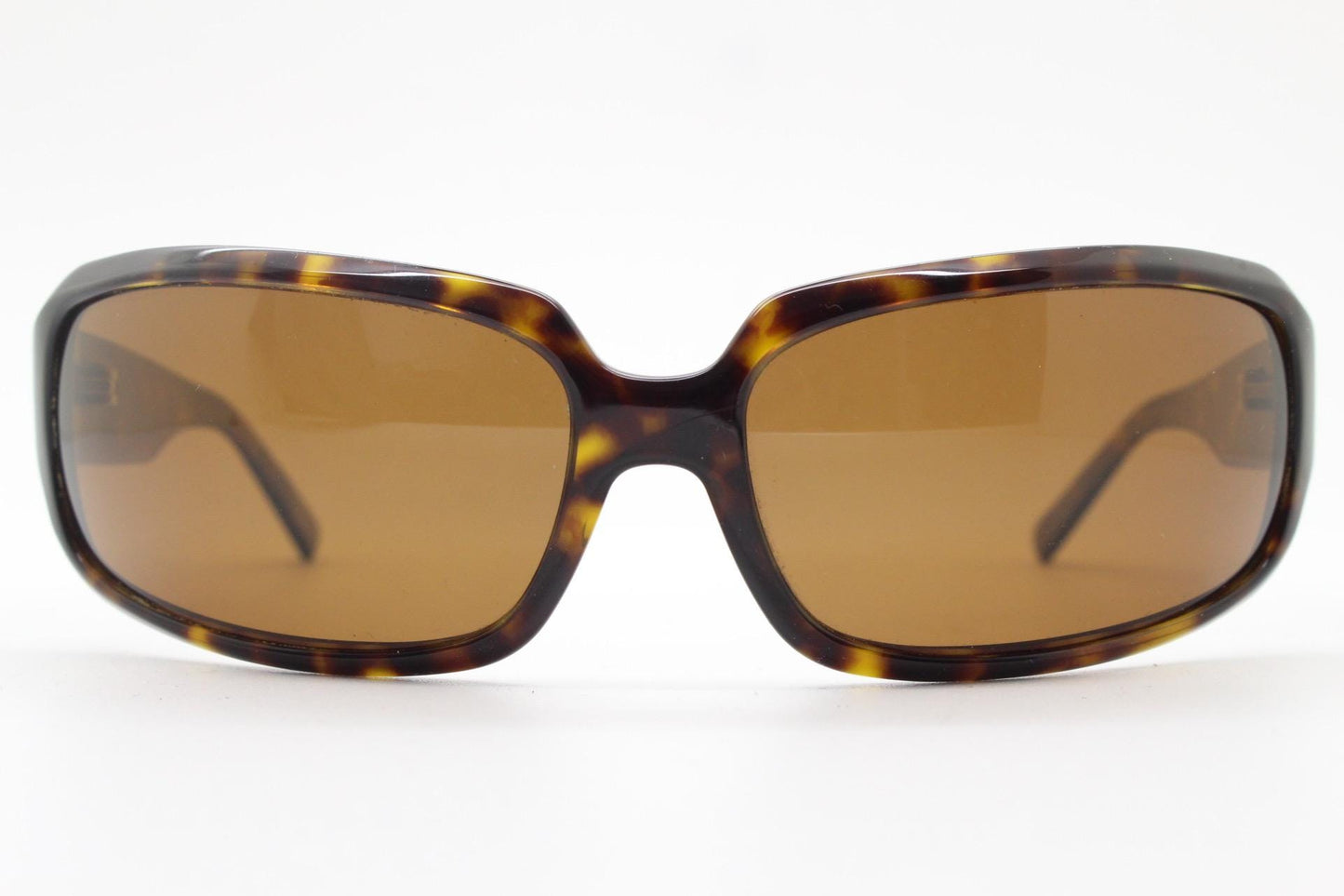 Oliver Peoples vintage Y2K wrap around sunglasses model Impala made in Japan. Curved bug eye in mottled brown tortoise acetate