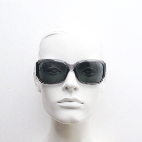 Polaroid Y2K vintage shield sunglasses. Transparent grey wrap around with red diamante LOVE logo and polarising lens. 2000s. Rhinestone