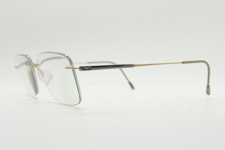 Silhouette rectangular frameless eye glasses model 7719 made in Austria. Minimal lightweight titanium optical frame. Prescription RX