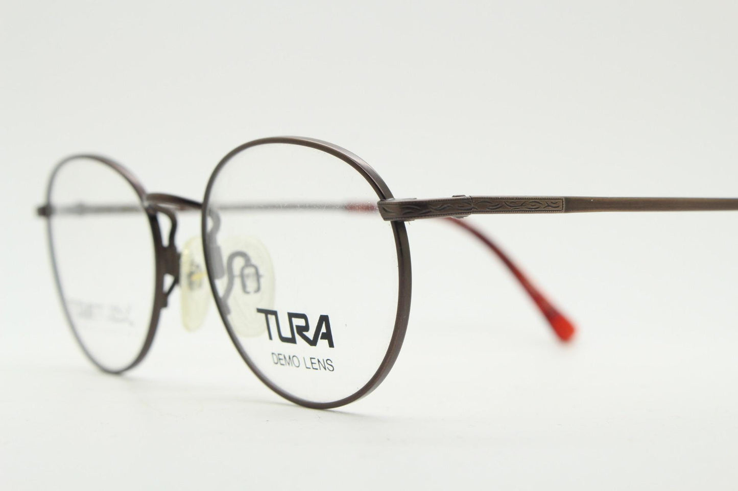 Tura 90s vintage oval eye glasses made in Japan. Satin metallic bronze finish optical frame in neat proportions. Prescription. Unused BNWT