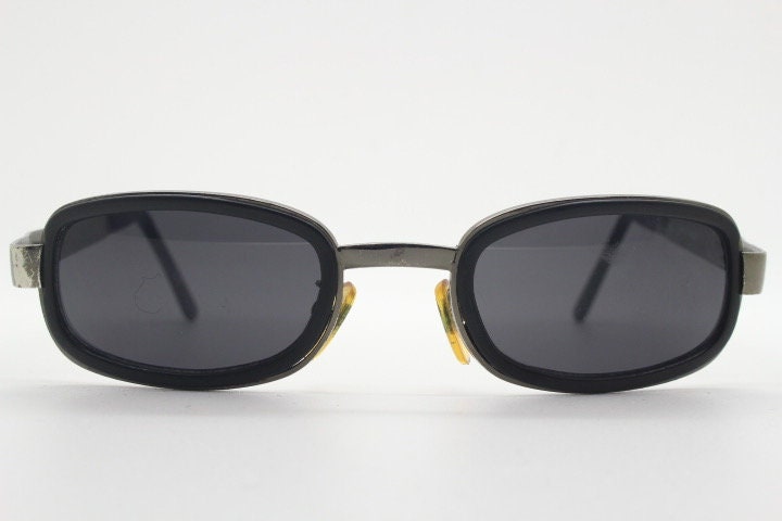 Byblos 90s vintage low profile rectangular sunglasses made in Italy. Gunmetal grey chrome frame with black insets and cut out arm logo's