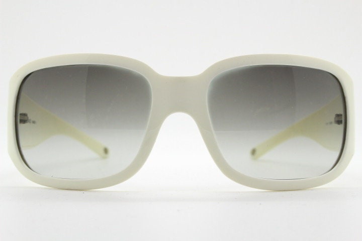 Versace Y2k vintage wrap around bug eye sunglasses. Curving white acetate shield frame with huge spell out diamante logo. 2000s. Rhinestone