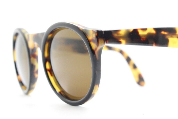 Francois Pinton Paris 90s vintage round sunglasses made in France. Womens thick acetate frame in honey tortoise brown tones. NOS