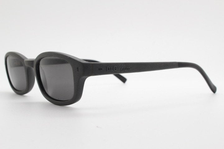 Dolce and Gabbana gum sunglasses made in Italy. Mens 90s vintage innovative flexible grey rubber frame with black lenses