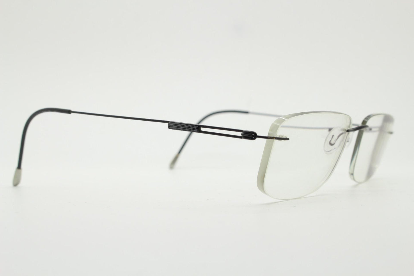 Silhouette rectangular frameless eye glasses made in Austria. Extremely minimal lightweight grey titanium optical frame. Prescription RX