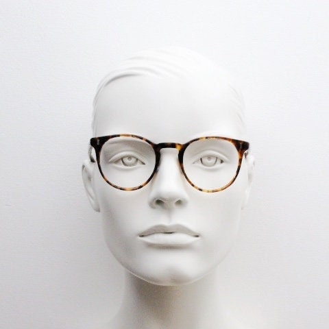 Cubitts vintage round 40s design hand made eye glasses. Honey tortoise acetate optical frame with keyhole bridge. Prescription RX