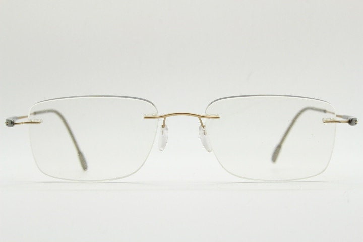 Silhouette rectangular frameless eye glasses model 7719 made in Austria. Minimal lightweight titanium optical frame. Prescription RX