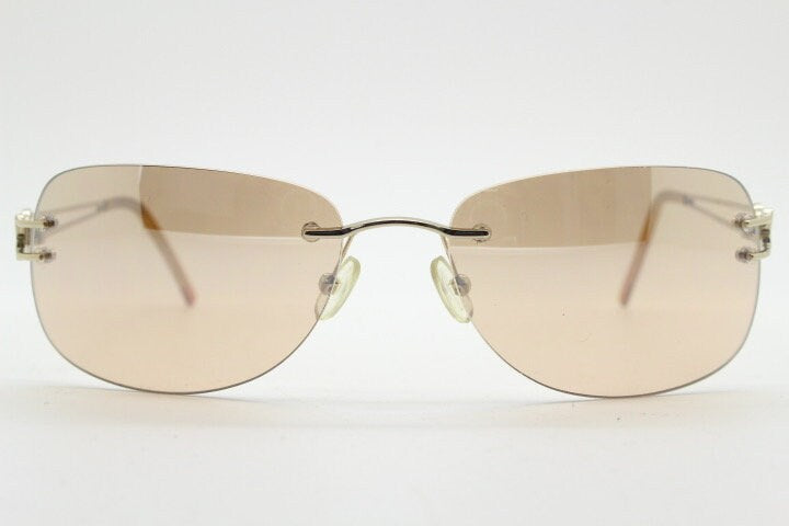 Y2K vintage rimless rectangular sunglasses. Frameless 2000's brown lens with slight mirror glaze gold trim and butterfly hinges. 00's NOS