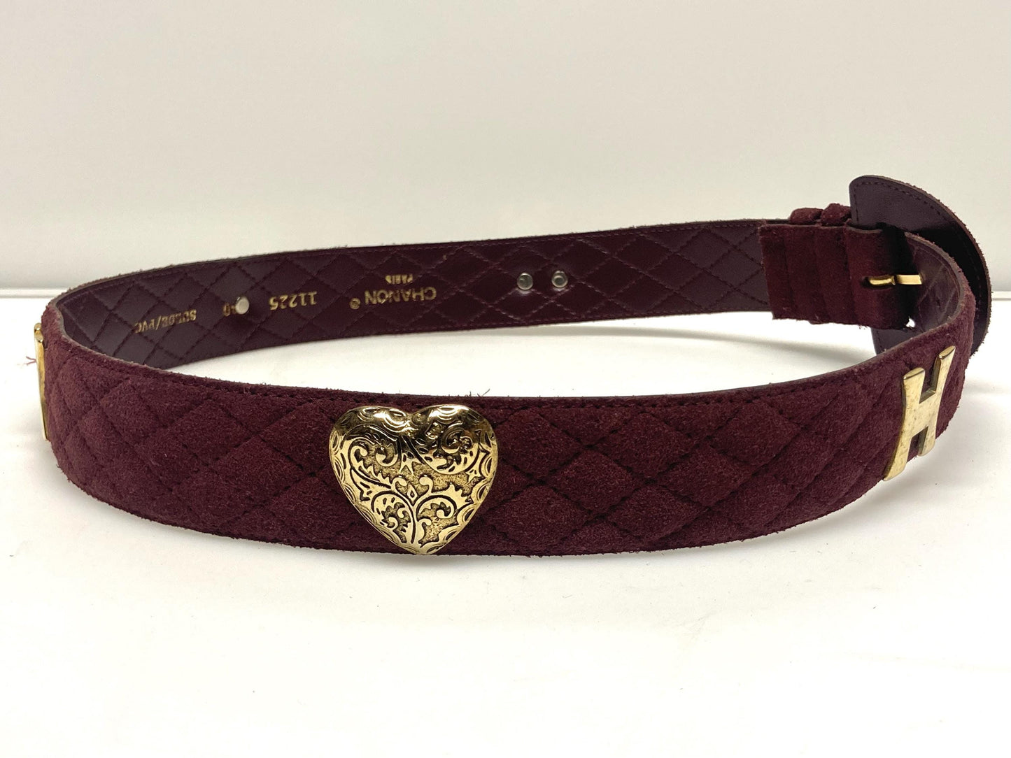 80s vintage womens dress belt in wine real suede with substantial covered buckle and gold domed hearts. Made in France by Chanon. NOS