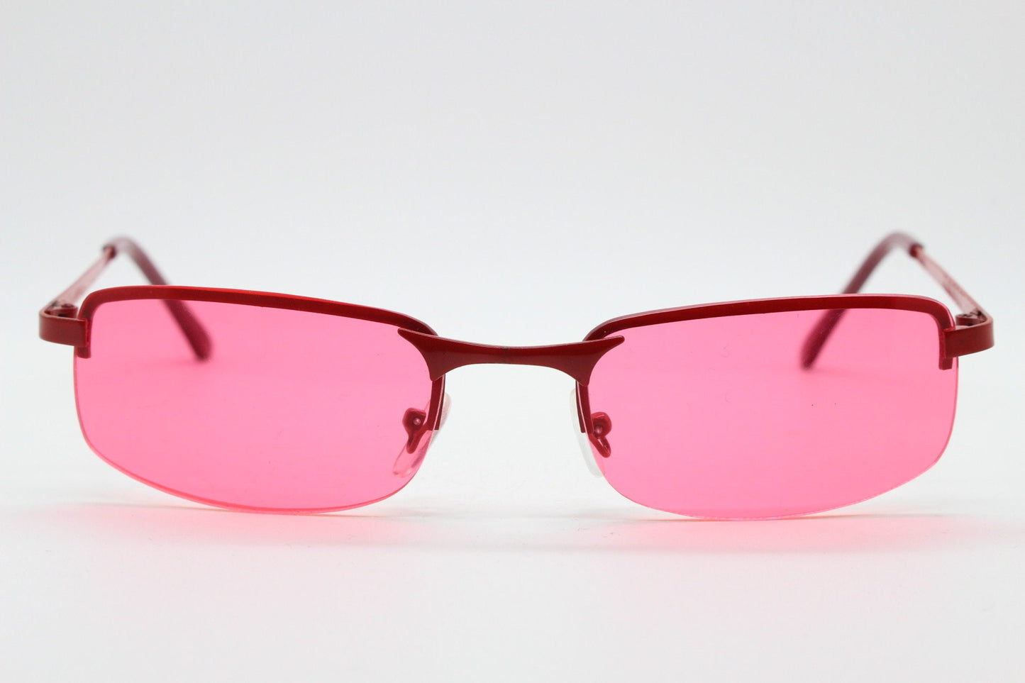 Y2K vintage half frame sunglasses with rectangular pink lenses and matching frame colours. 2000s NOS. 00's. 90s Rave