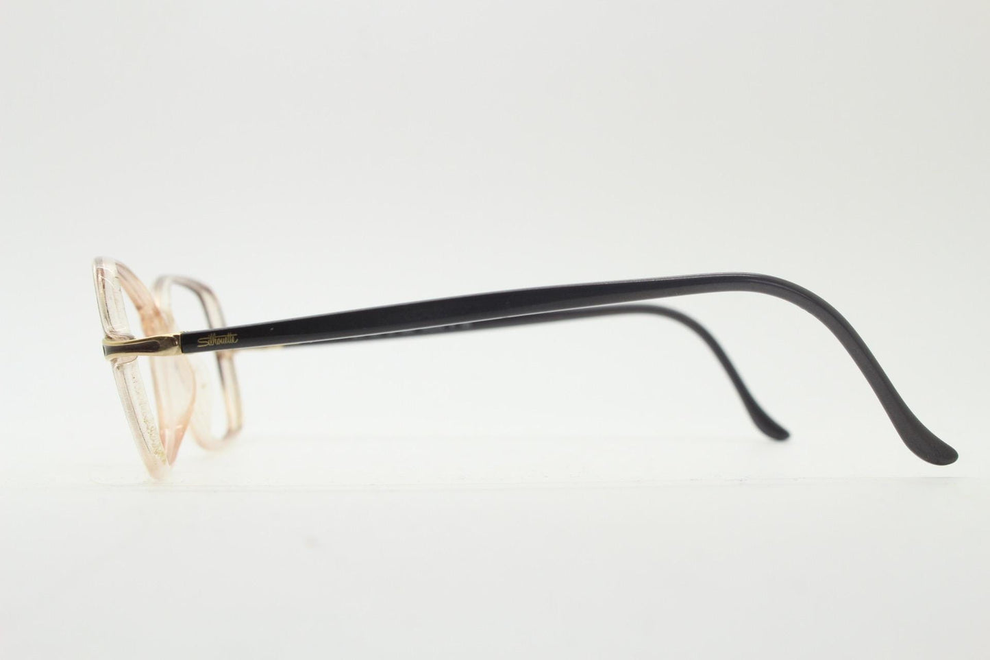 Silhouette 80s vintage oval eye glasses made in Austria. Transparent crystal optical frame with giraffe arm print. Prescription RX
