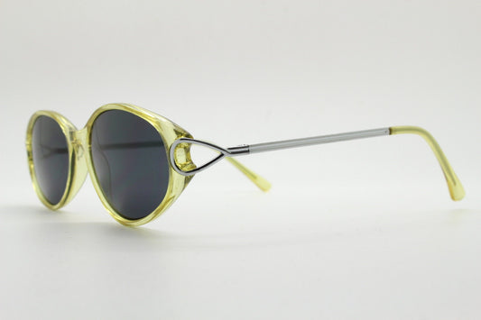 Carven Paris 90s vintage oval sunglasses. Womens transparent yellow frame with black lenses and silver metal arms. NOS