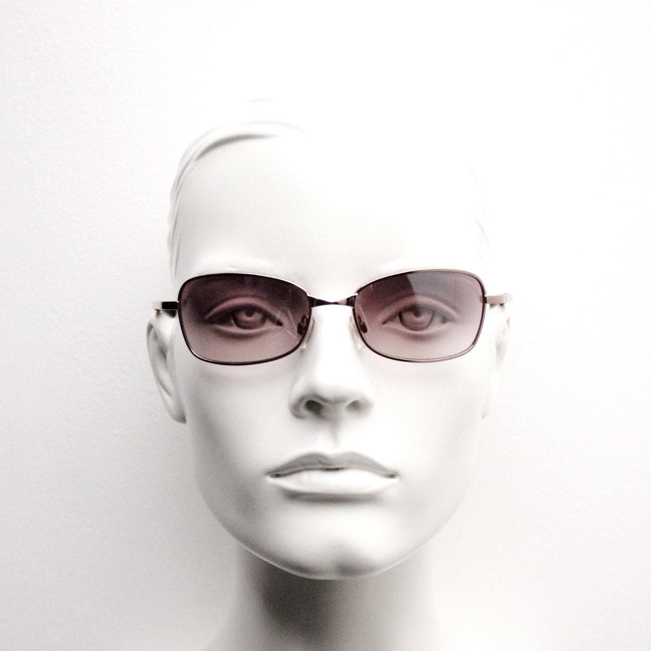 Y2K vintage curved sunglasses. Unusual Pink chrome metal frame with matching flared rectangular lenses. Unused 2000s NOS