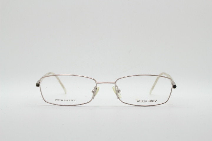 Giorgio Armani 90s vintage oval eye glasses made in Italy. Gold front with marbled white acetate arms. Optical frames. Prescription RX