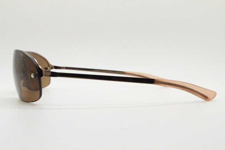 Y2K vintage oval aviator sunglasses. Metallic brown chrome half frame with mid tone curved bug eye lenses and straight arms. 2000's. NOS