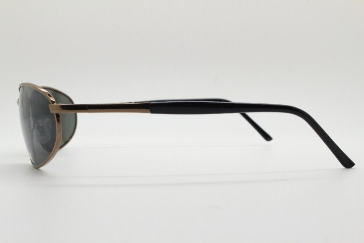 Y2K vintage small bug eye sunglasses. Curved brown chrome metal frame with black arms. Unused 2000s NOS