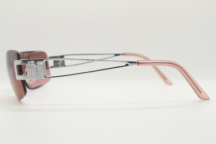 Y2K vintage rectangle frameless visor sunglasses. 2000's chrome trim wrap around with pink curved and bevelled lenses. 00's NOS