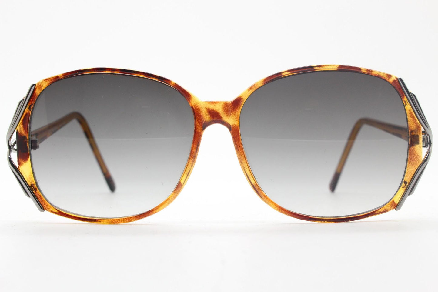 80s vintage square sunglasses. Womens honey tortoise frame with dynamic metal  forked side joints and graduating lenses. 70s. Unused NOS