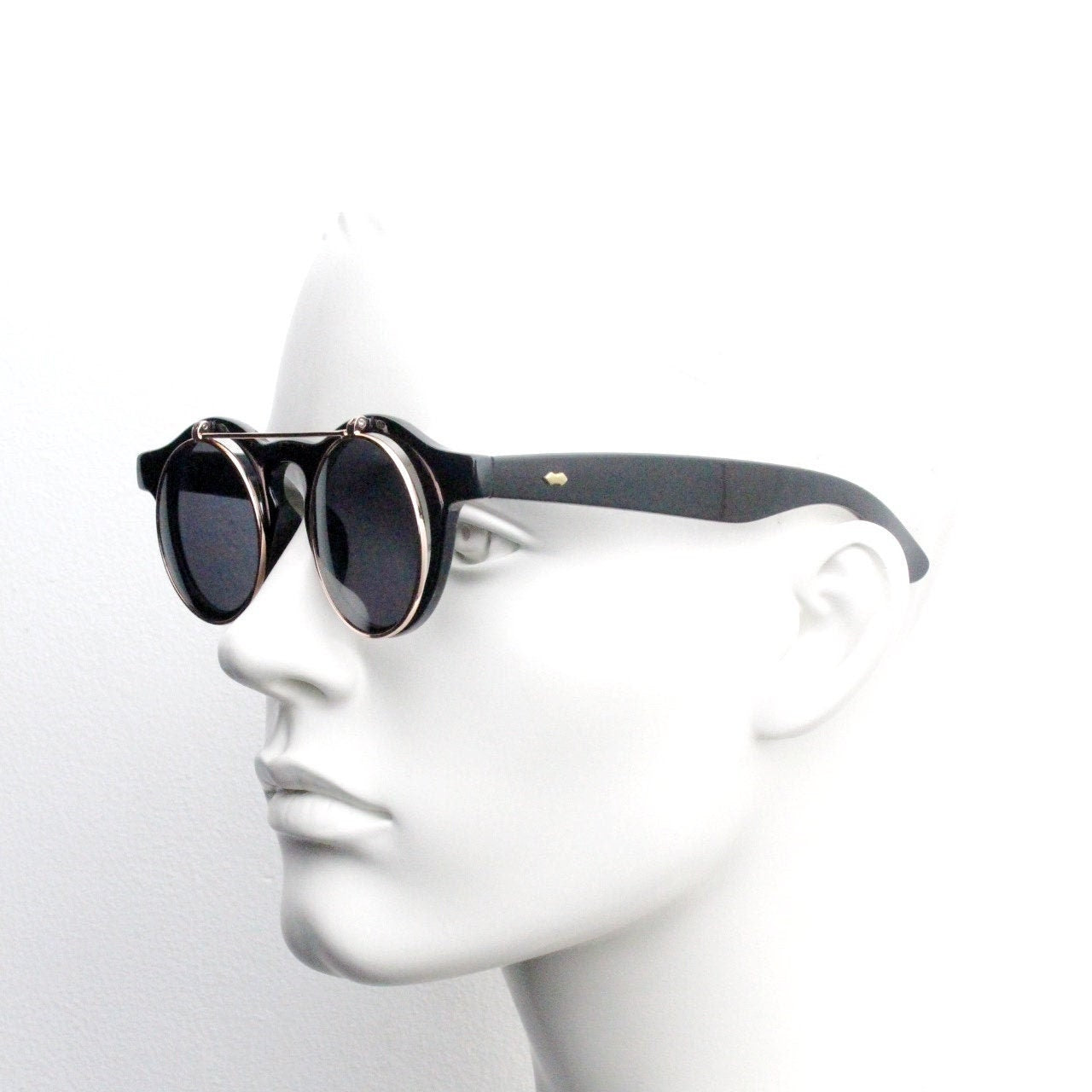 Vintage 90s round flipper sunglasses. 30s style black frame with clear lenses and flip up sunglasses visor. BNWT unused