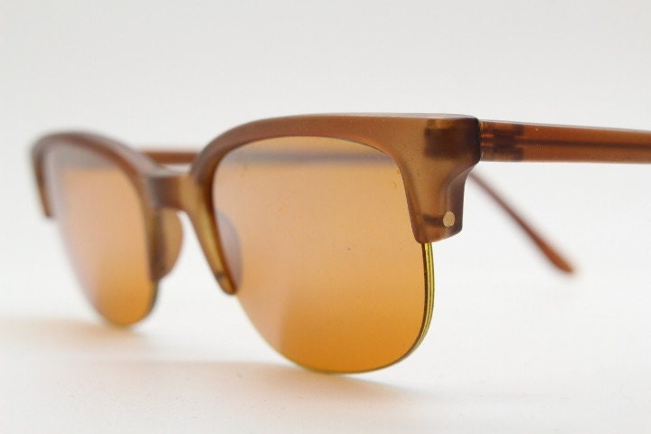 90s vintage low profile cat eye sunglasses. Transparent half frame cateye with matching mirror glazed light tone lenses. NOS