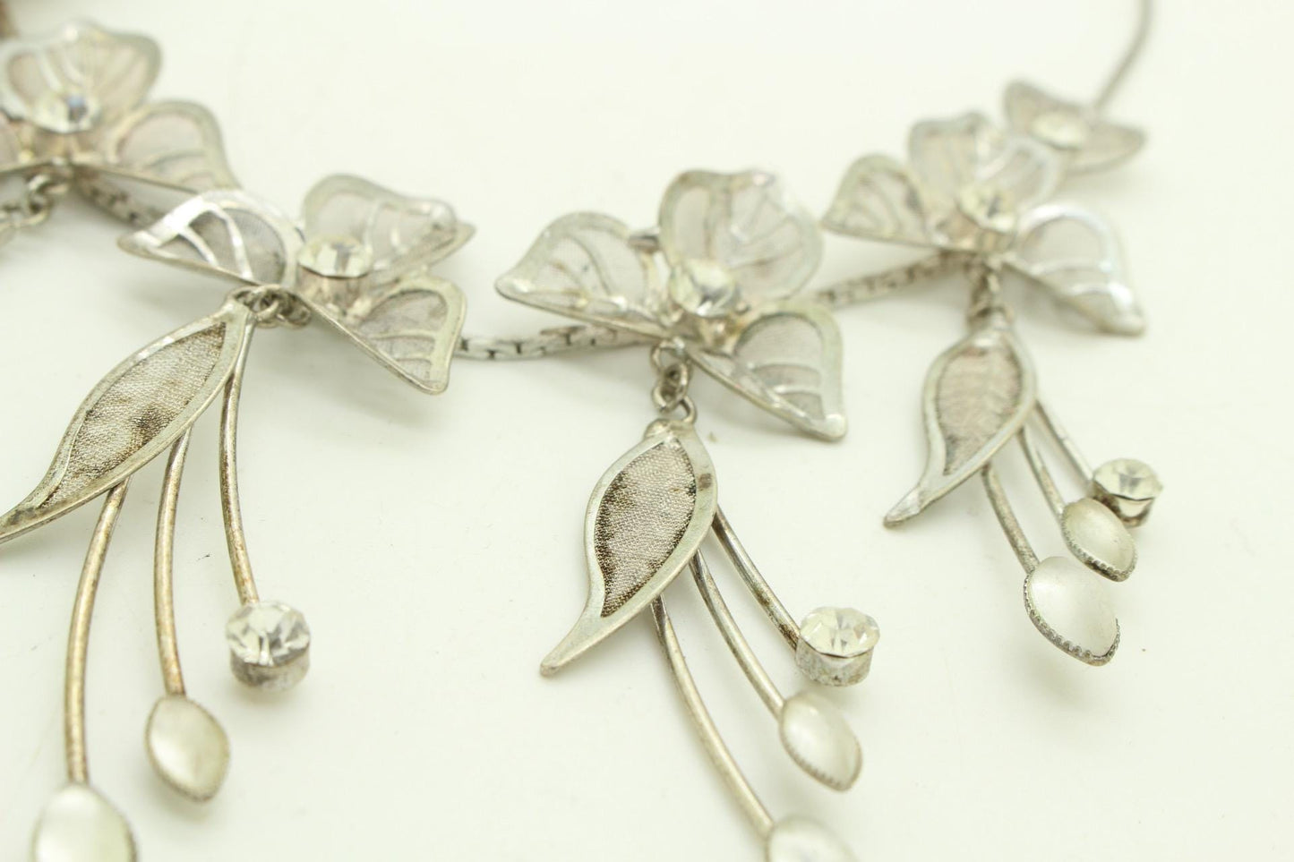 90s vintage extensive statement flower chain necklace. Full breasted array of mesh backed petals and dangling leaves with diamante centres