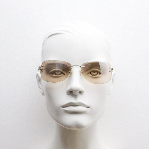Y2K vintage rimless rectangular sunglasses. Frameless 2000's brown lens with slight mirror glaze gold trim and butterfly hinges. 00's NOS