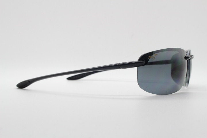 Maui Jim sport wrap around sunglasses made in Japan. Lightweight half frame shield with curving lenses. 2000's. Y2K