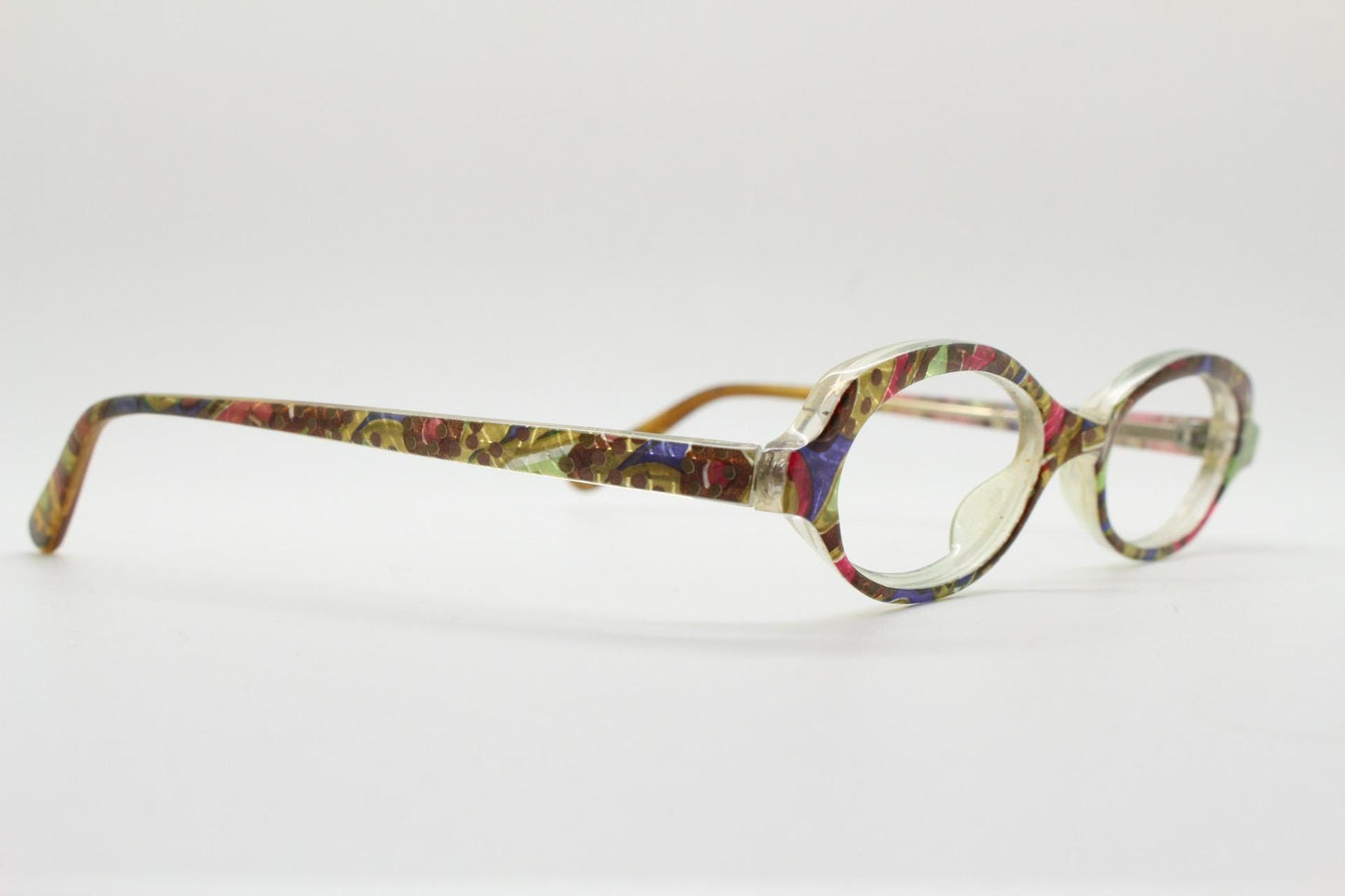 90s vintage small oval eye glasses. Low profile acetate optical frame with extraordinary abstract multi coloured pattern. Prescription RX