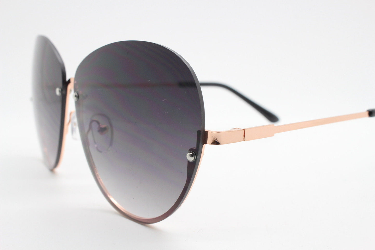 Y2K vintage large rimless sunglasses. Women's 70s style half frame design with graduating black lenses and gold arms. 2000s BNWT