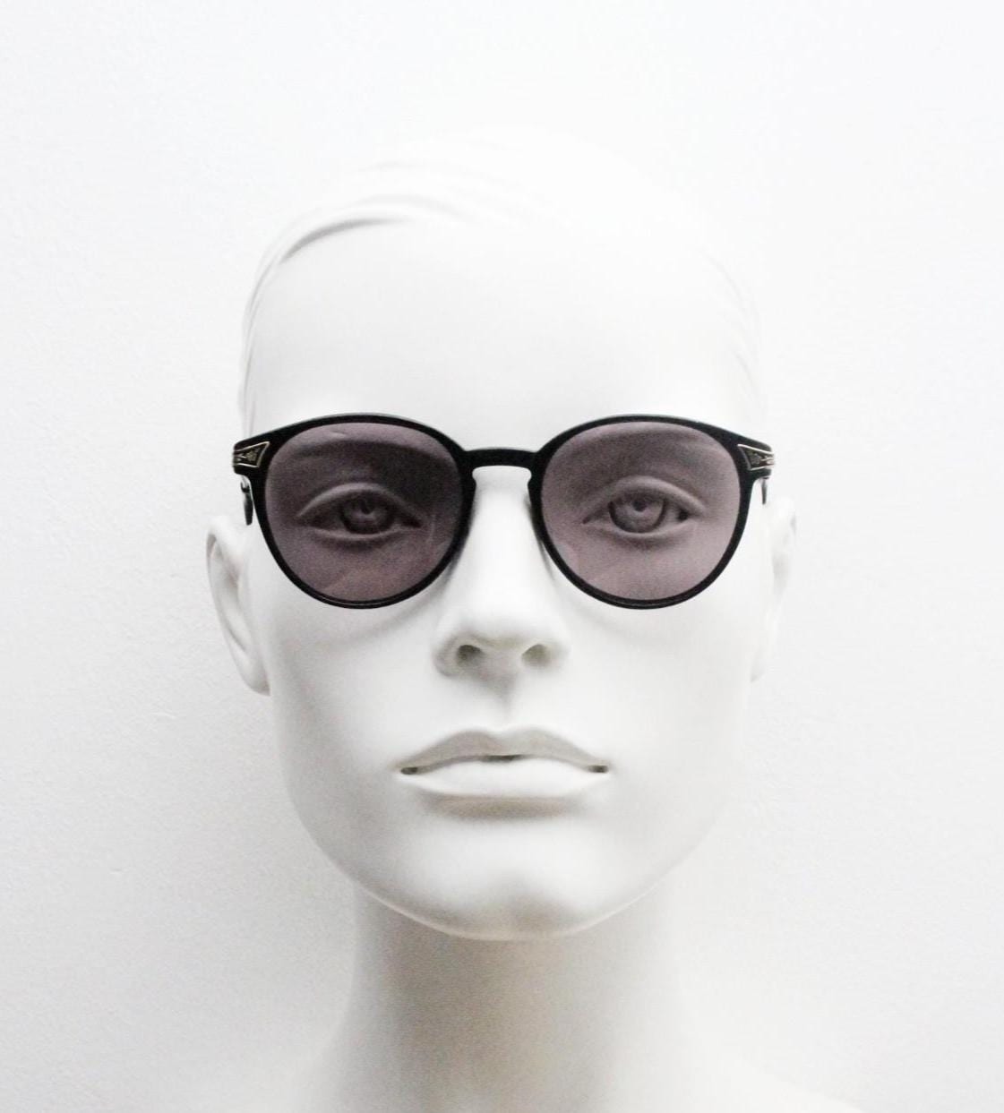 Laura Ashley 90s vintage round sunglasses. Refined 1940s design in black acetate with ornate embossed metal arm details. Unused NOS