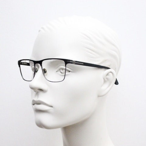 Calvin Klein rectangular eye glasses. Gunmetal grey chrome wire optical frames with black matt brow. Prescription eyeglasses. RX Spectacles