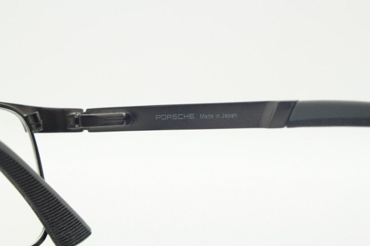 Porsche design rectangular eye glasses model 8251 made in Japan. Minimal gunmetal grey wire optical frame. Prescription RX spectacles