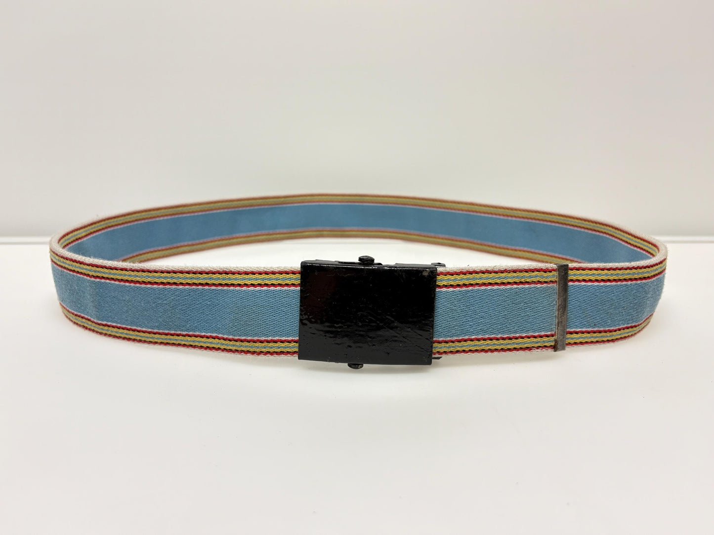 Y2K vintage 2' canvas army style belt in sky blue with red, white and yellow rainbow stripes. 2000s Mens large. Fully adjustable size range